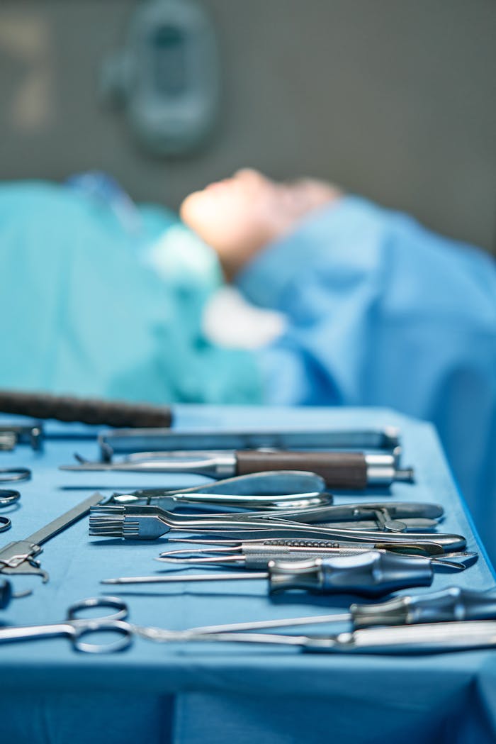 why-choose-us Close-up of surgical tools in an operating room setting, emphasizing precision and sterility.